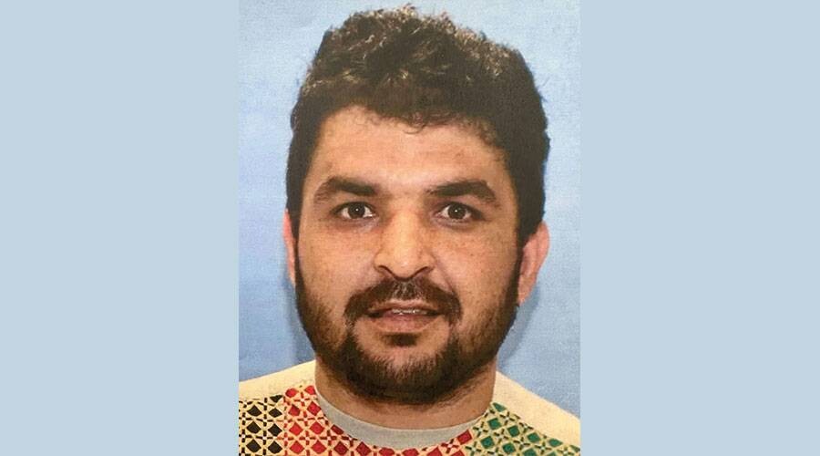 Afghan faces trial for killing two guards